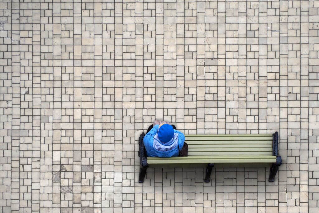 Woman_sitting_alone_on_bench